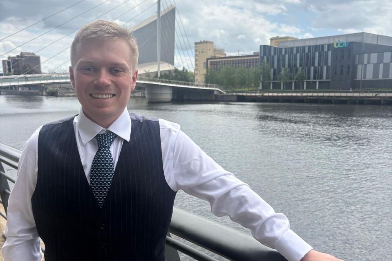 George Isaacs, ACCA and ATT qualified accountant, by the water at Salford Quays